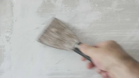 Worker Clean Old Plaster from the Wall the with a Spatula Video stock 80482780