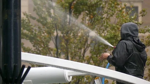 Worker cleaning building outdoor Stock Footage 69893652