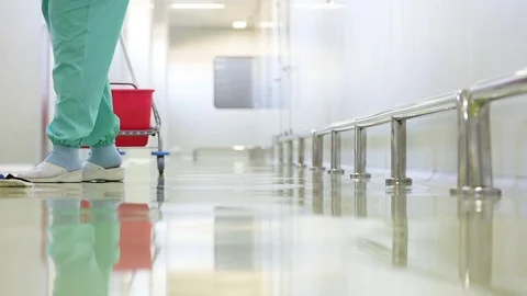 Worker cleaning floor with machine Stock Footage 84117984