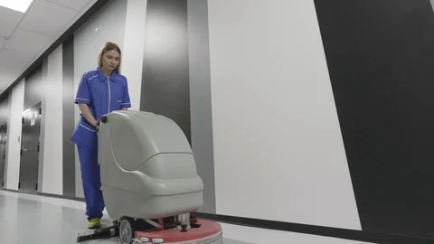 Worker is cleaning the floor with machine Stock Footage 107588150