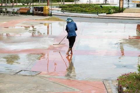 The worker cleaning the floor. Stock Photos