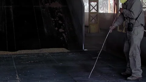 Worker Cleaning Grain Unloading Ramp at Industrial Port Facility - Slow Motion Stock Footage 320951236