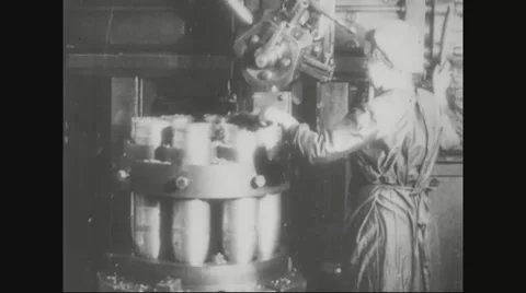 Worker cleaning missile shells rotating in machine Stock Footage 43312149