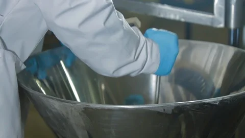 Worker cleaning modern equipment on ice cream factory at the factory. Equipment Stock-Footage 120935397