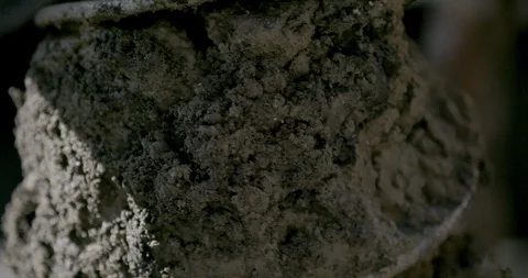 Worker cleaning mud from the drill auger Stock Footage 145282494