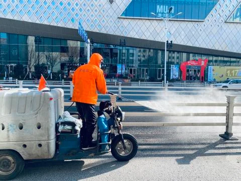 A worker cleaning with pressure machine Stock Photos