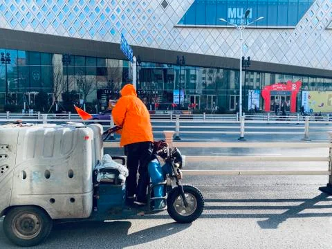 A worker cleaning with pressure machine Stock Photos