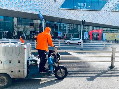 A worker cleaning with pressure machine Stock Photos