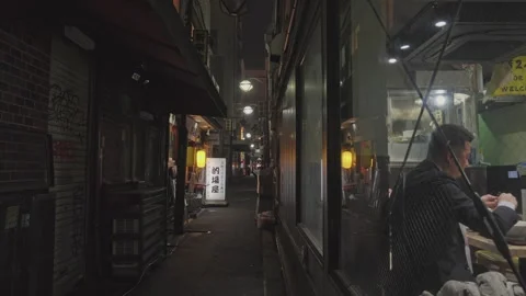 Worker Cleaning Restaurant Window on Narrow Dimly Lit Night Back Alley — Ueno Stock Footage 337036004