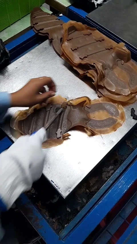 Worker Cleaning Rubber Material for Shoe Outsole Manufacturing Stock Footage 345070247