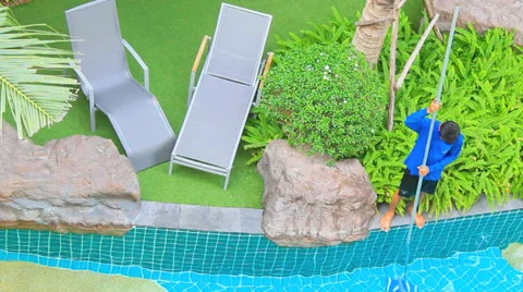 Worker cleaning swimming pool. Stock Footage 55372915