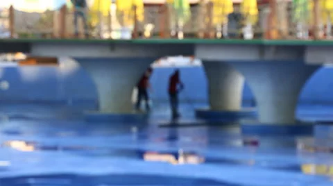 Worker is cleaning a swimming pool with a pressure pump Video stock 64178791
