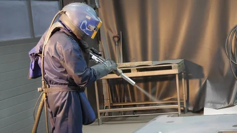 The worker cleans the elements by sanding Stock Footage 86250620