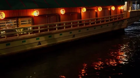 Worker Cleans Glass in Floating Restaurant with Red Lanterns in Tokyo Stock Footage 312231926