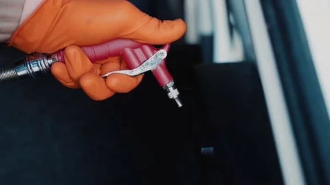 A worker cleans the interior of the car with a special tool under pressure Stock Footage 146562350