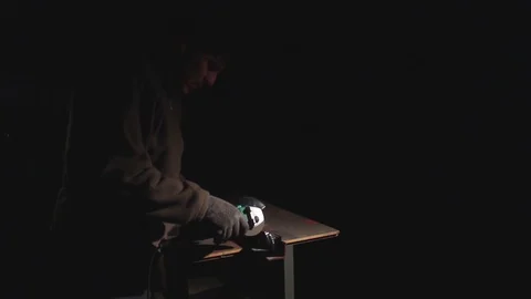 Worker cleans metal grinder Stock Footage 70618654