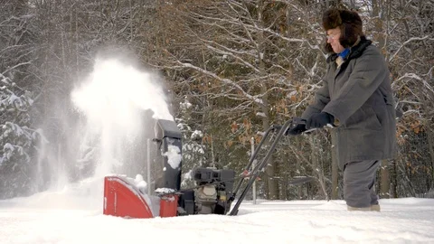Worker Cleans Road From Snow With Snow Plow On Background Of Forest In Winter Video stock 101587614