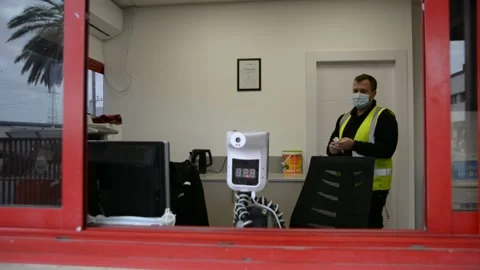 The worker cleans up the workplace.  The guard is doing disinfection.  soft focu 스톡 동영상 147056977