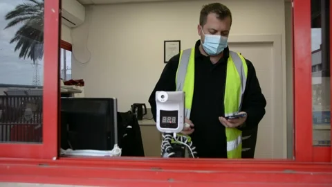 The worker cleans up the workplace.  The guard is doing disinfection.  soft focu Stock Footage 147057089