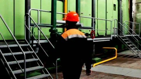 Worker Climbs And Goes Away Inside Unit Stockbeeldmateriaal 10804688