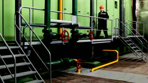 Worker Climbs And Goes Platform Inside Unit Stockbeeldmateriaal 10804682