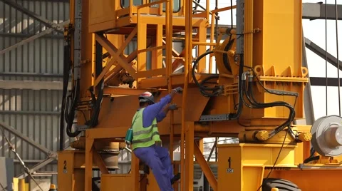 Worker Climbs On The Crane Stock Footage 63990052