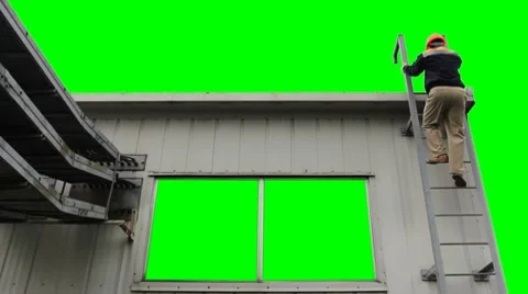 Worker Climbs Up To House Green Screen Stock Footage 8659475