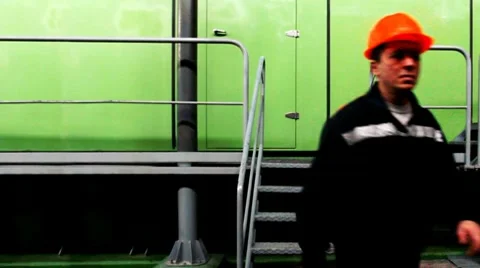Worker Climbs Stairs To Platform Stock Footage 10790380