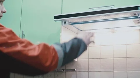 The worker closes the flap in the kitchen Stock Footage 77195939