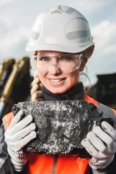 Worker with coal in the hands Stock Photos