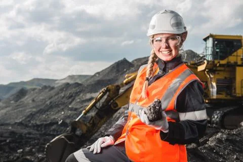 Worker with coal in the hands Stock Photos