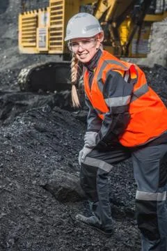 Worker with coal in the hands Stock Photos