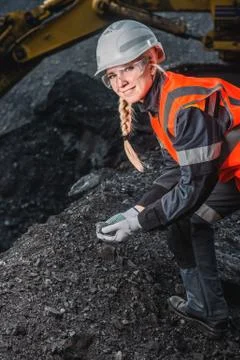 Worker with coal in the hands Stock Photos