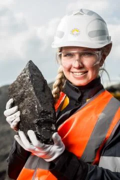 Worker with coal in the hands Stock Photos