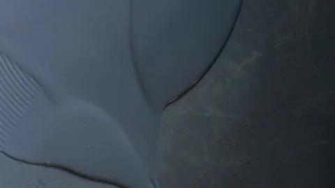 Worker, coating floor with self-leveling epoxy resin in the workshop of the p Stock Footage 150877149