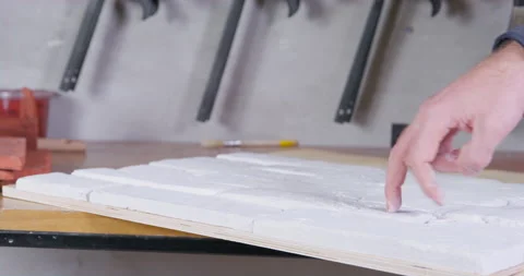 Worker collected a fragment from tile based on casts of old bricks, covered it Stock Footage 179211172