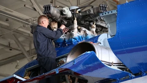 The worker collects the engine of the aircraft. Stock Footage 86490718