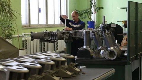 The worker collects the engine. Stock Footage 86193336