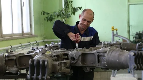 The worker collects the engine. Stock Footage 86193344