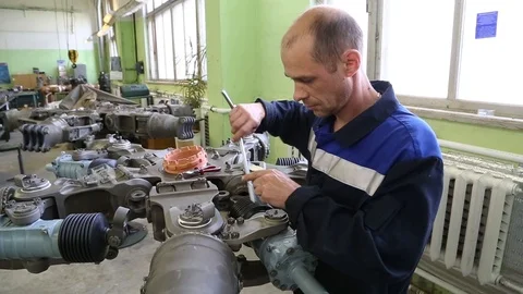 The worker collects the engine. Stock Footage 86193354