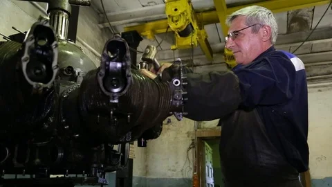 The worker collects the engine. Stock Footage 86490687