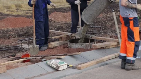 The worker concrets the foundation. Stock Footage 219928403