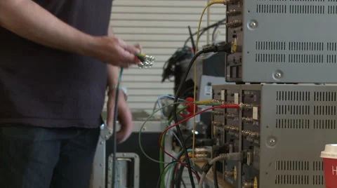 Worker connecting cables Stock Footage 64125590
