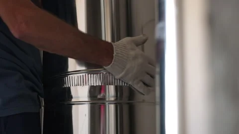 Worker connecting stainless steel ventilation duct sections Видео 342612175