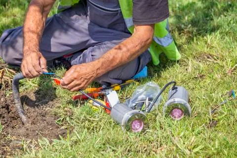 Worker connecting wire Stock Photos