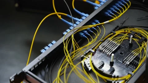 Worker connects optical line internet wire in connection box. Service man Stock Footage 156341522