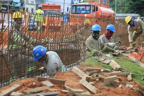 Worker in the construction of the BRT system Stock Photos
