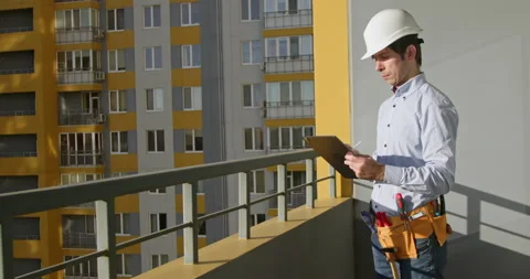 A worker in a construction helmet  Stockbeeldmateriaal 229653538