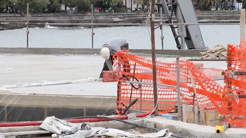 Worker on construction site with circular saw Stock Footage 126091903