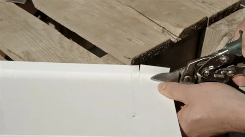 Worker on a construction site cut stainless steel sheet shears of metal cutting Stock Footage 65291465